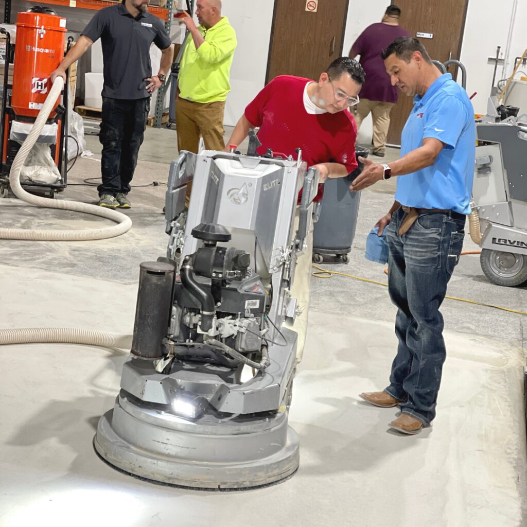A group of men working on a machine.