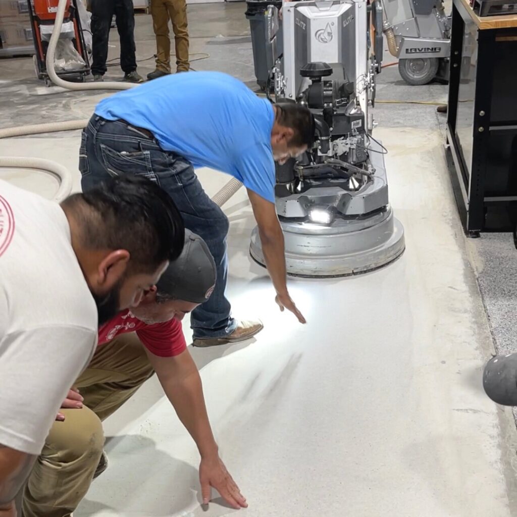 A group of men working on the floor.