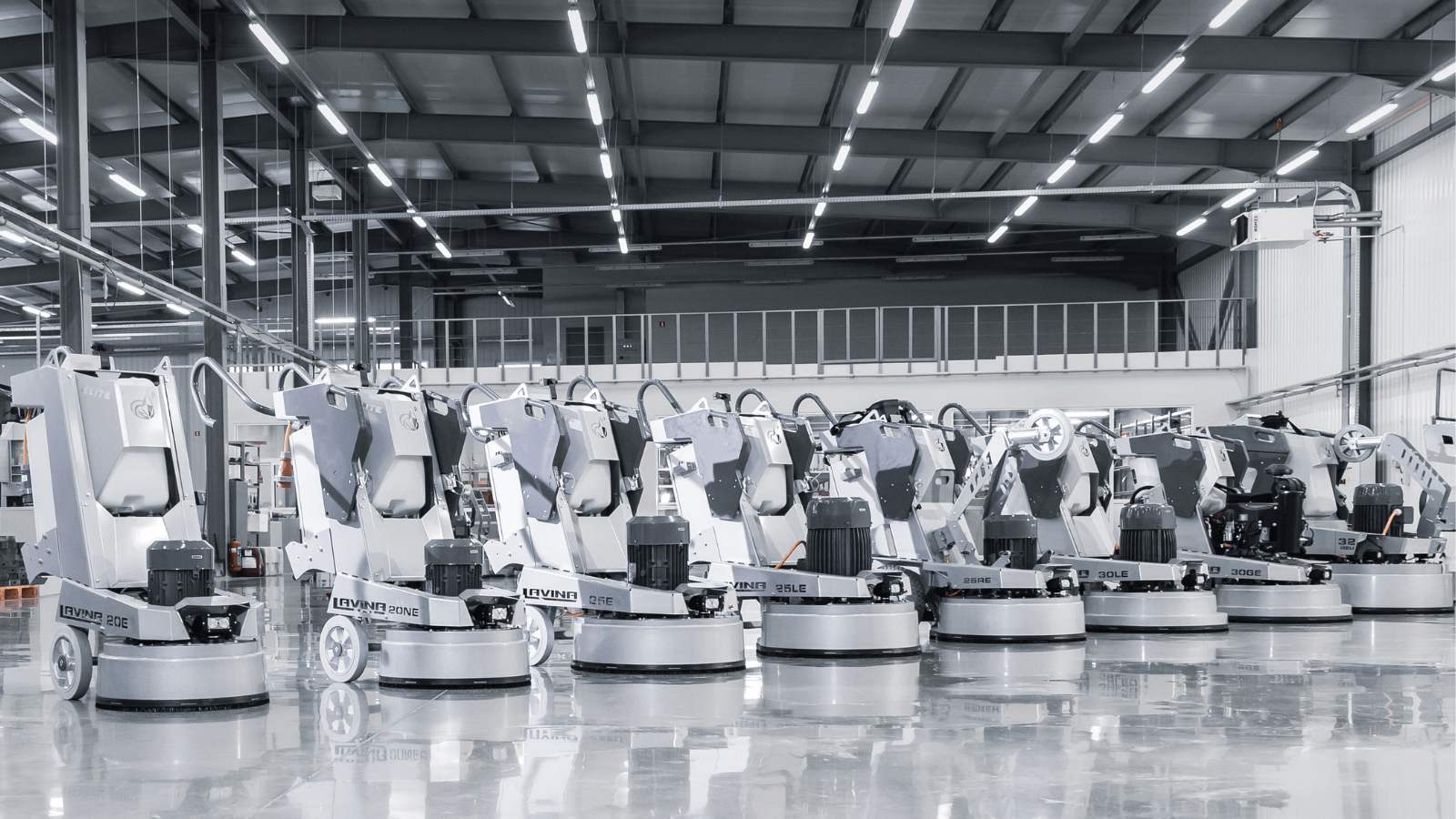 A group of people standing around luggage carts.