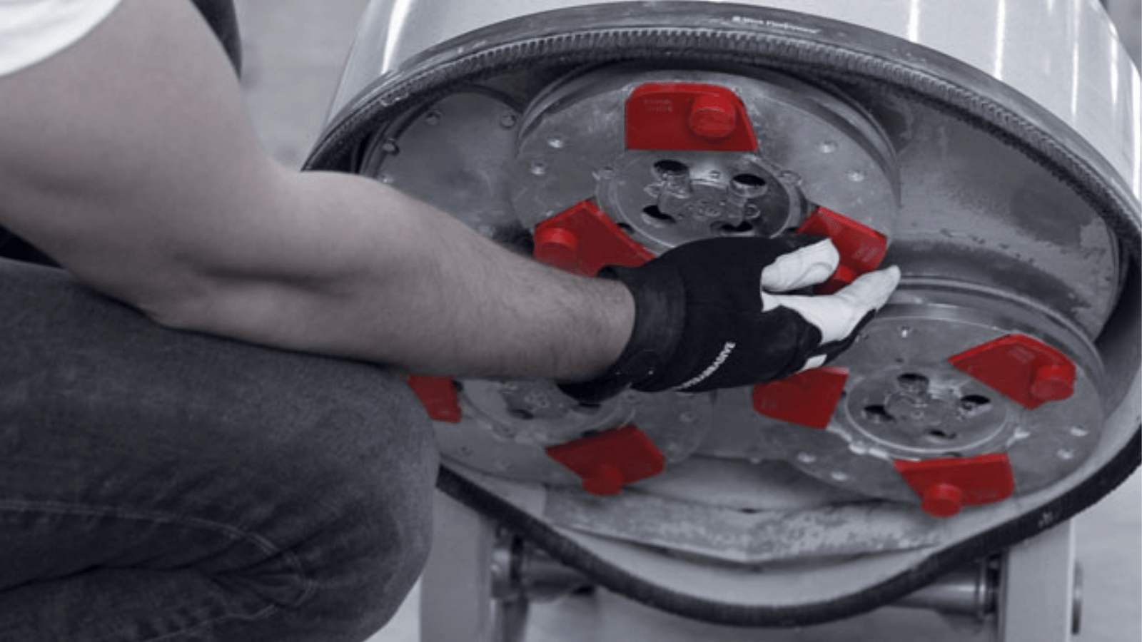 A person wearing gloves and holding something in their hand.