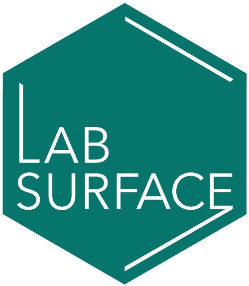 A green sign that says lab surface.